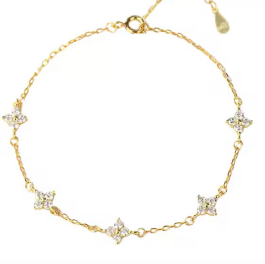 Bracelet dore  trefle strass